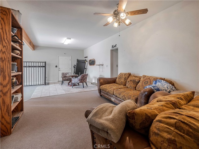 living room featuring light carpet and ceiling fan