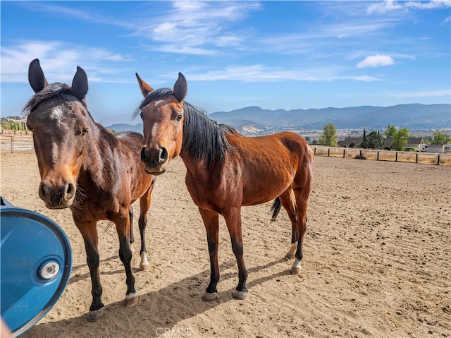 view of stable with a mountain view