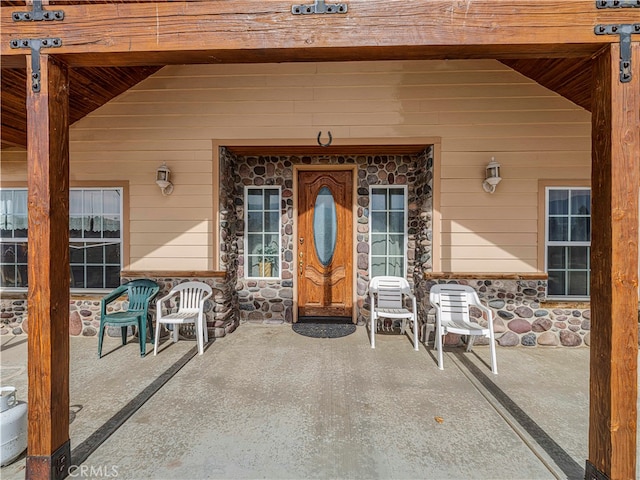 property entrance with a patio