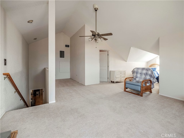 sitting room with lofted ceiling, light colored carpet, and ceiling fan