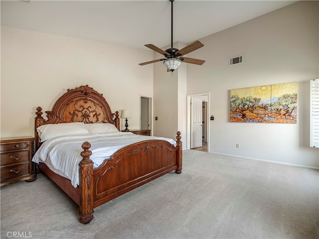 bedroom featuring light colored carpet, high vaulted ceiling, and ceiling fan