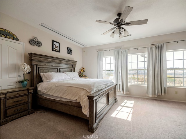 bedroom with ceiling fan and light colored carpet