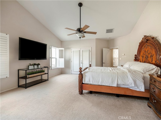 carpeted bedroom with ceiling fan and lofted ceiling