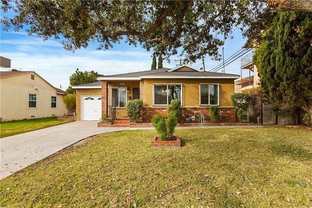 view of front of house featuring a garage and a front lawn