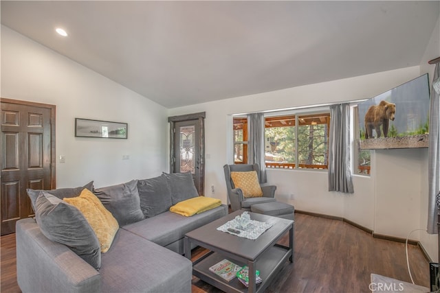 living room with vaulted ceiling and dark hardwood / wood-style floors