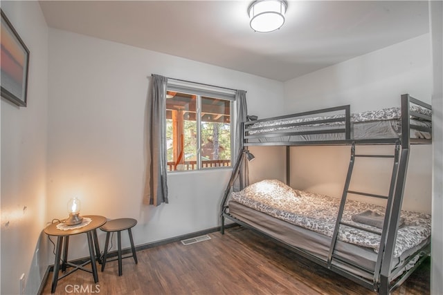 bedroom featuring dark hardwood / wood-style flooring