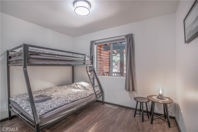 bedroom featuring dark wood-type flooring