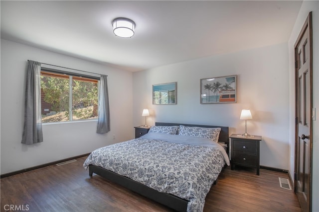 bedroom featuring dark hardwood / wood-style floors