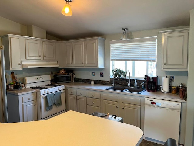 kitchen with white cabinetry, sink, and white appliances