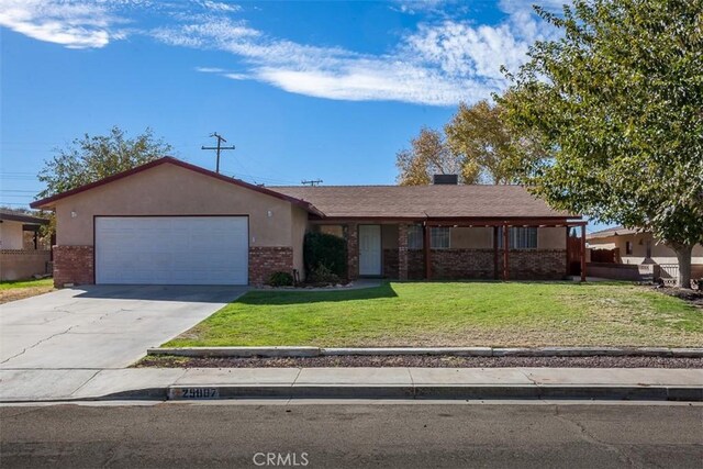 ranch-style home with a front lawn and a garage