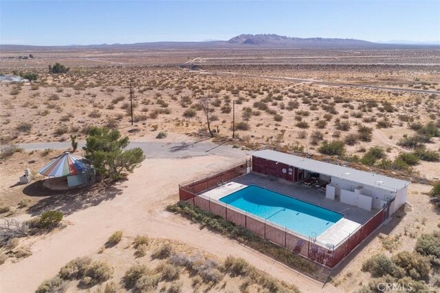 birds eye view of property with a mountain view