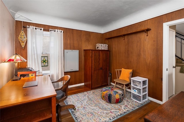 office area featuring wood walls and hardwood / wood-style flooring