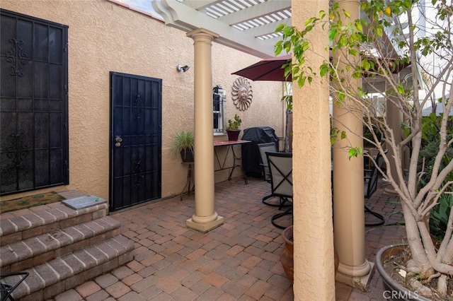 view of patio featuring a pergola