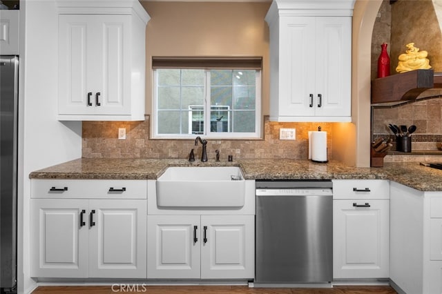 kitchen with appliances with stainless steel finishes and white cabinets