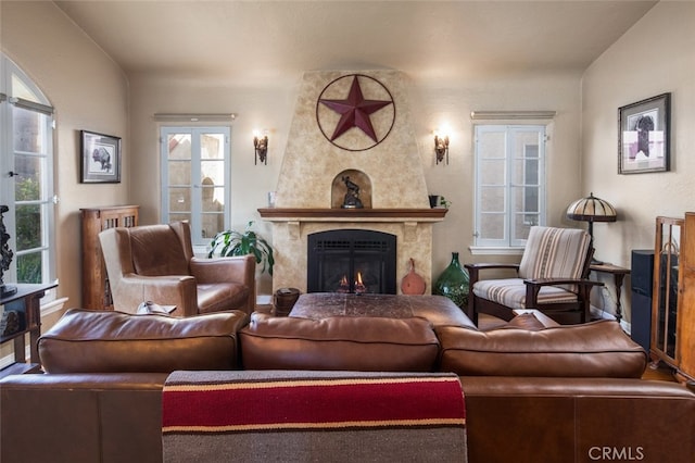 living room featuring a high end fireplace