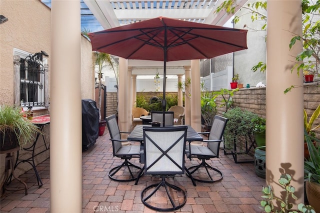 view of patio featuring a grill