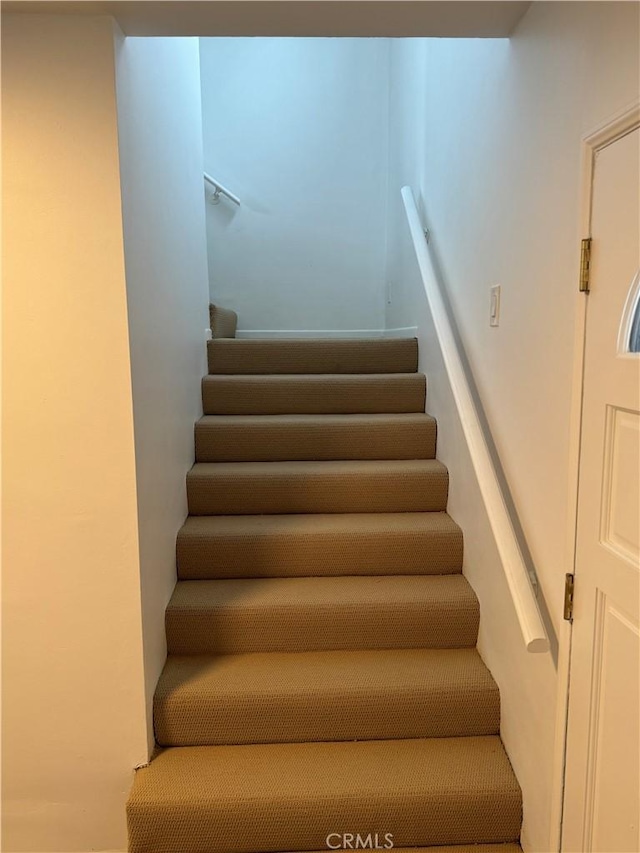 corridor featuring hardwood / wood-style floors