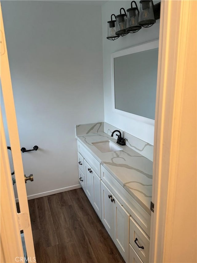 bathroom with vanity and hardwood / wood-style flooring