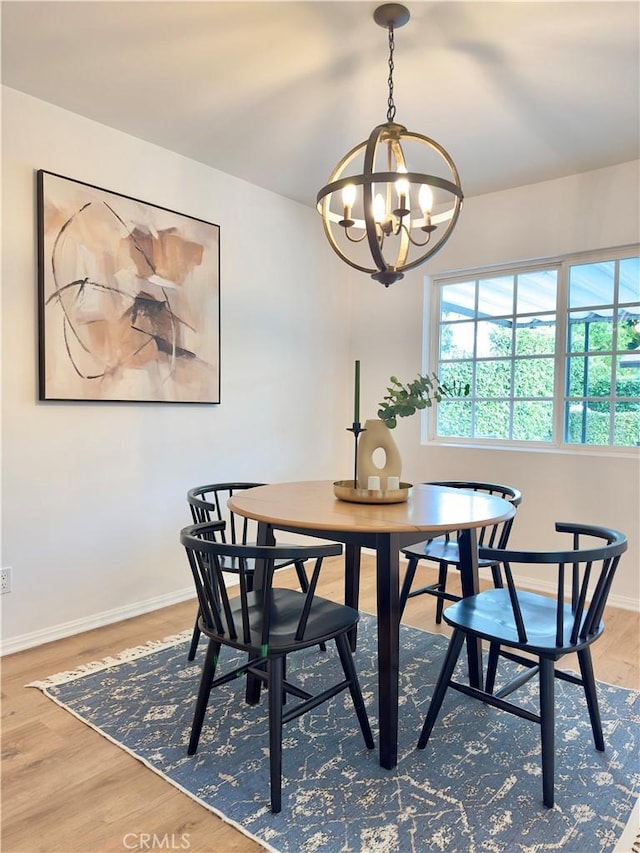 dining room featuring a chandelier and hardwood / wood-style flooring