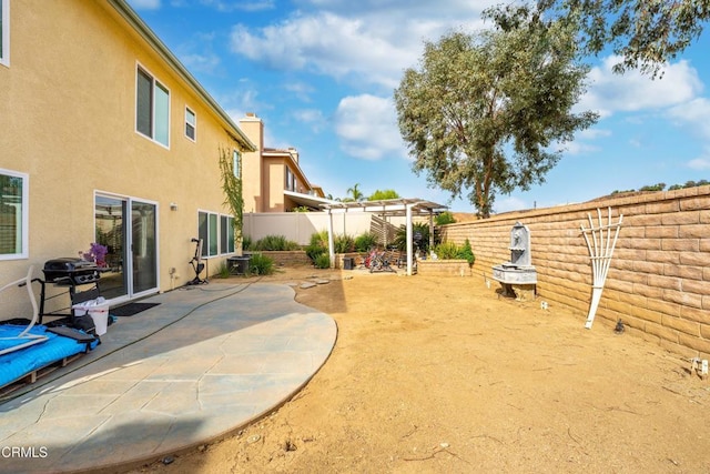 view of yard with a fenced backyard and a patio