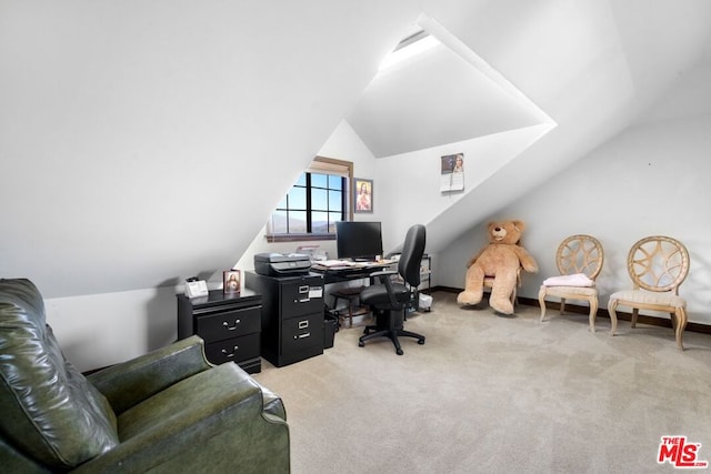 office area featuring light colored carpet and lofted ceiling