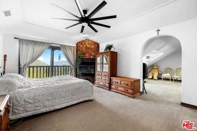 carpeted bedroom with access to exterior, ceiling fan, and lofted ceiling