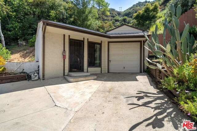 ranch-style home with a garage