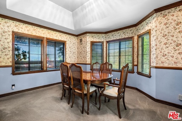 dining space with carpet flooring and ornamental molding