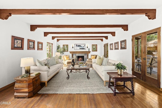 living room featuring french doors, hardwood / wood-style flooring, and beam ceiling