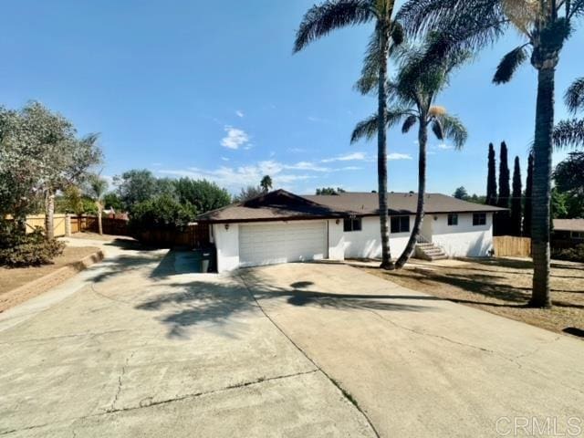 ranch-style house featuring a garage