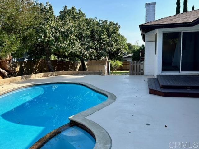 view of pool featuring a patio