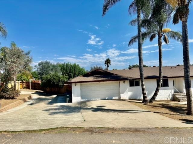 single story home with a garage