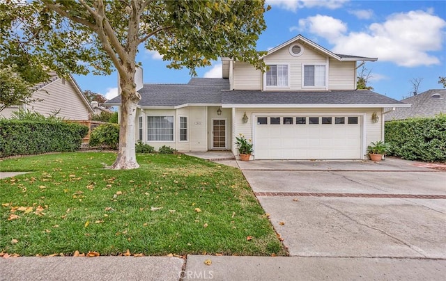 front of property featuring a garage and a front lawn