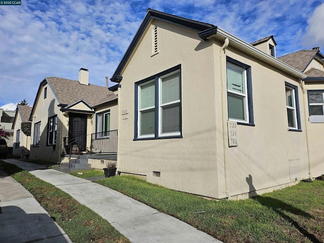 view of home's exterior featuring a yard