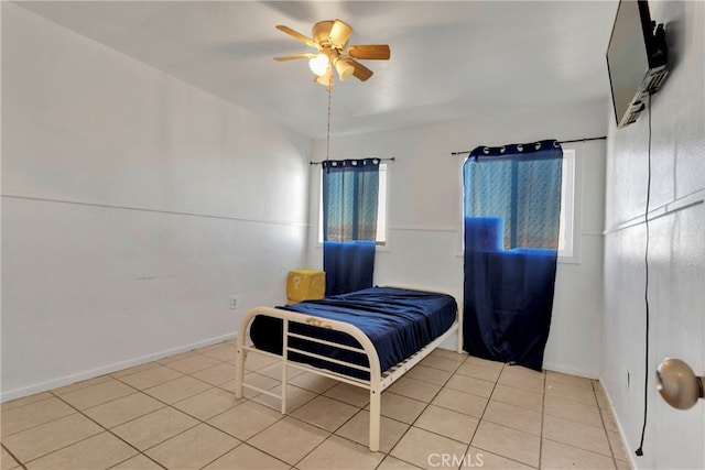 10394 Baker Rd, Lucerne Valley, CA 92356 - bedroom featuring multiple windows, light tile patterned floors, and ceiling fan