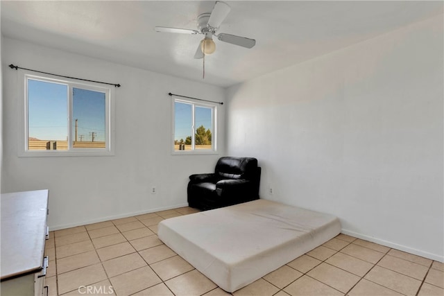 10394 Baker Rd, Lucerne Valley, CA 92356 - living area featuring ceiling fan and light tile patterned floors