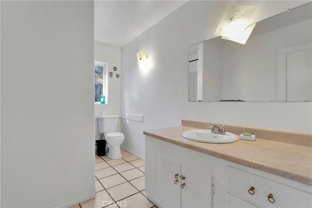 10394 Baker Rd, Lucerne Valley, CA 92356 - bathroom with vanity, toilet, and tile patterned flooring