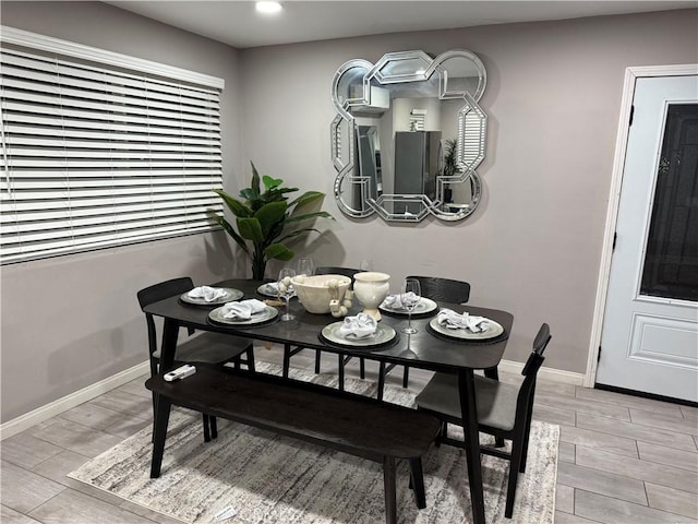 dining space with light wood-type flooring