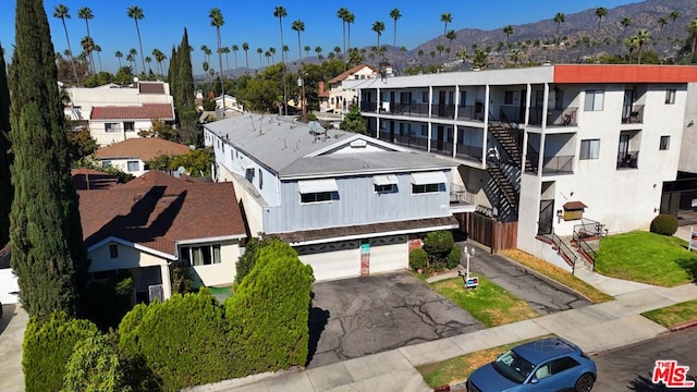 birds eye view of property with a mountain view