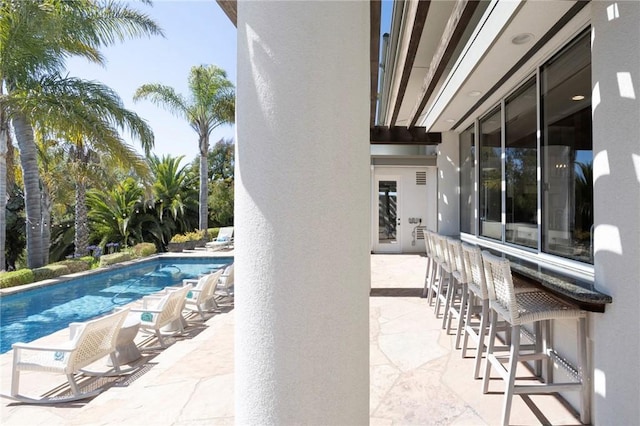 outdoor pool featuring a patio