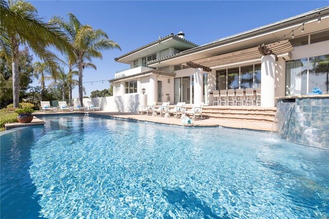 view of pool with a fenced in pool, a patio, and fence