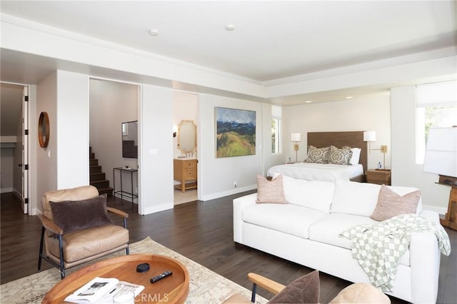 bedroom featuring baseboards and wood finished floors