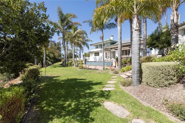 view of yard with an outdoor pool