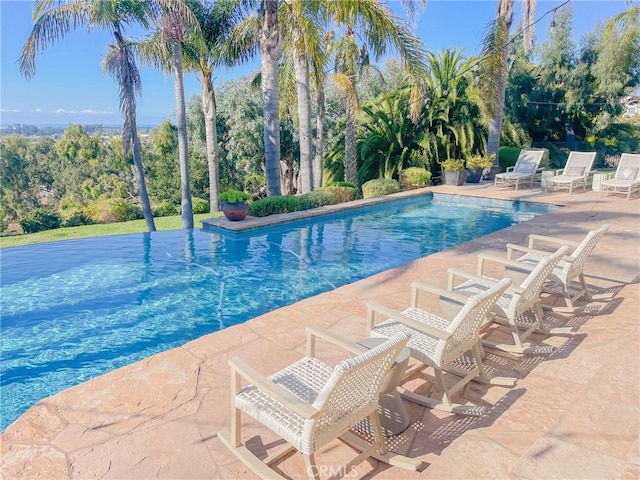 pool with a patio area