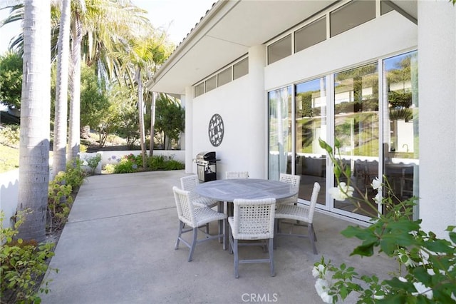 view of patio / terrace featuring a grill and outdoor dining area