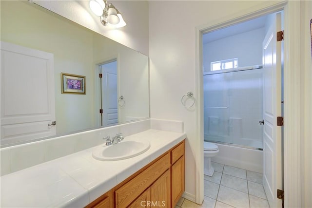 full bathroom with toilet, tile patterned floors, shower / bath combination with glass door, and vanity