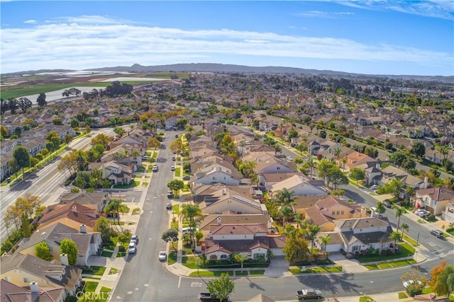 birds eye view of property with a mountain view