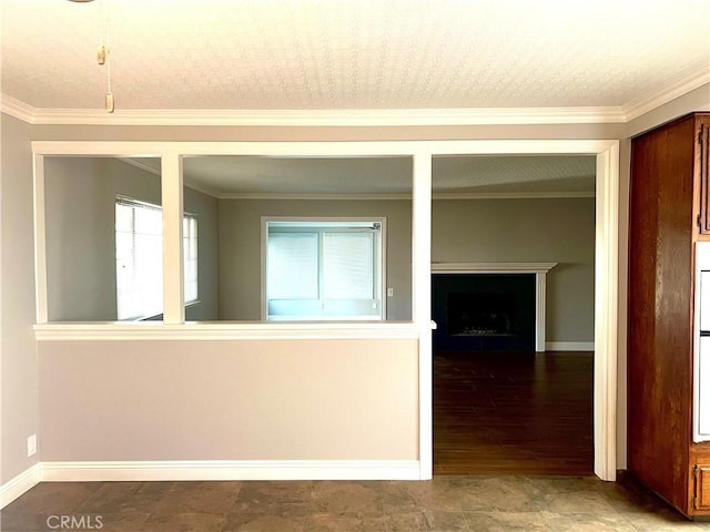 empty room with crown molding and hardwood / wood-style flooring