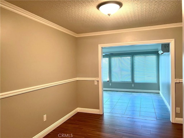 interior space with wood-type flooring, a textured ceiling, and ornamental molding