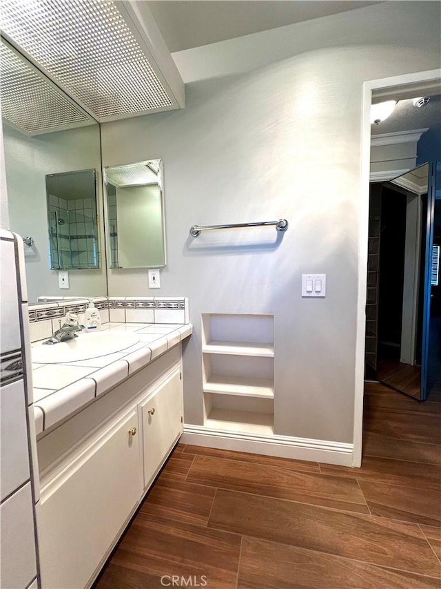 bathroom featuring hardwood / wood-style floors and vanity